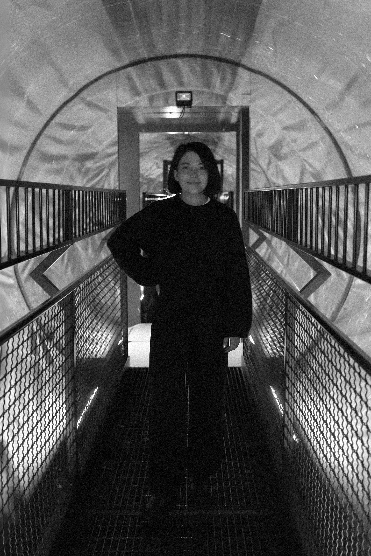 full body portrait of Juana Altergott standing in a futuristic tube
