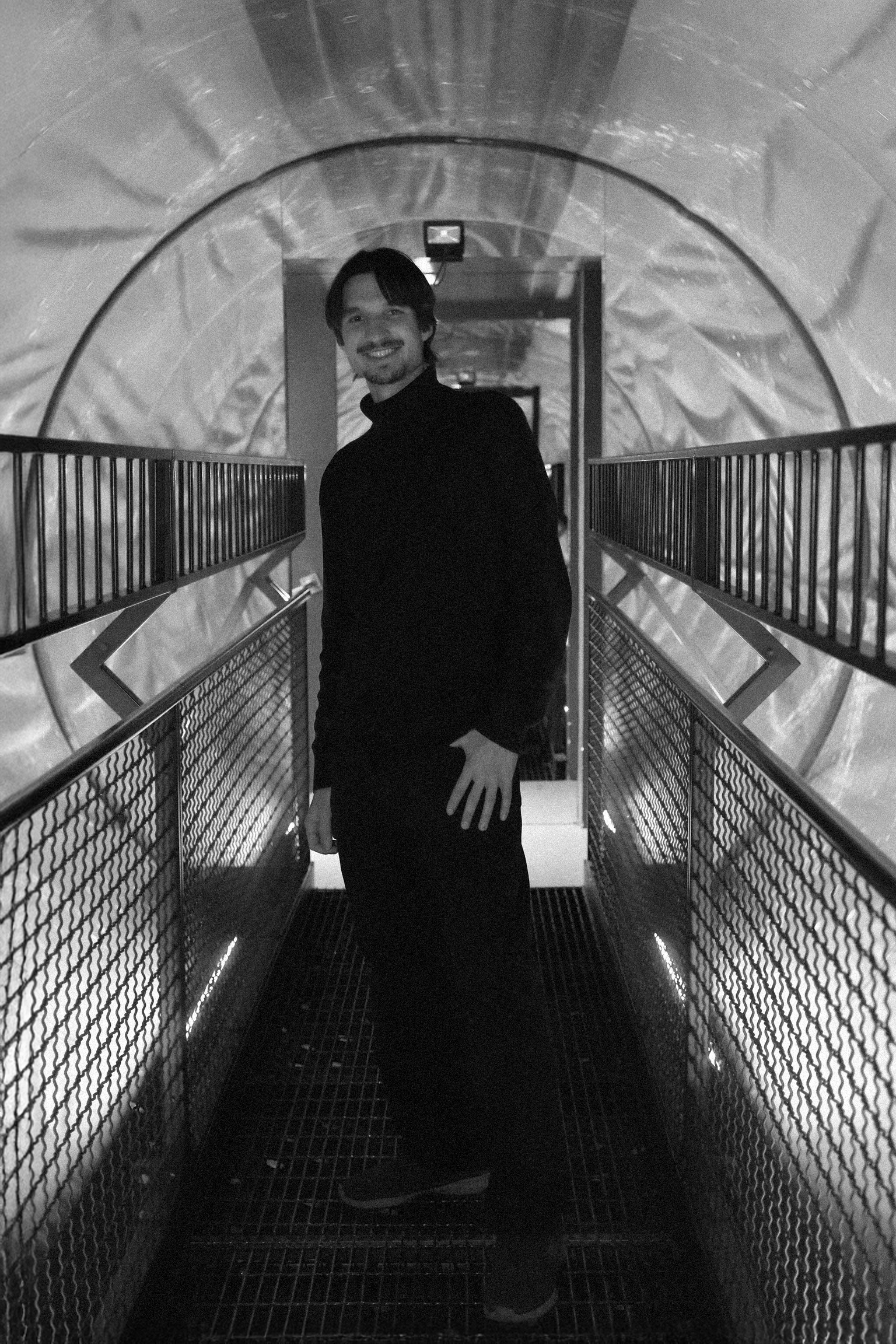 full body portrait of Luka Zovko standing in a futuristic tube
